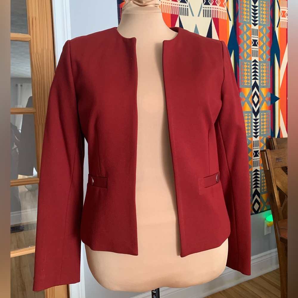 Red collarless blazer with button detail